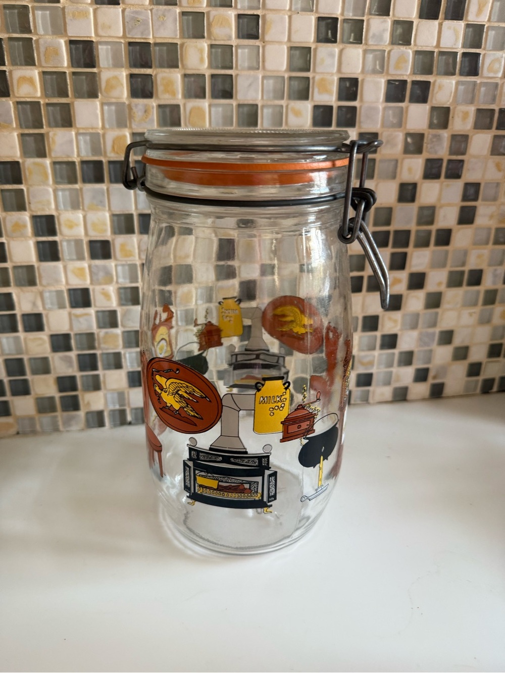 Airtight Glass Storage Jar with Orange Seal and Decorative Graphics